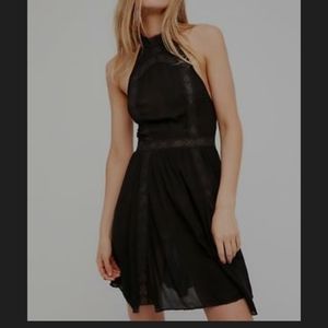 Open back halter style little black dress